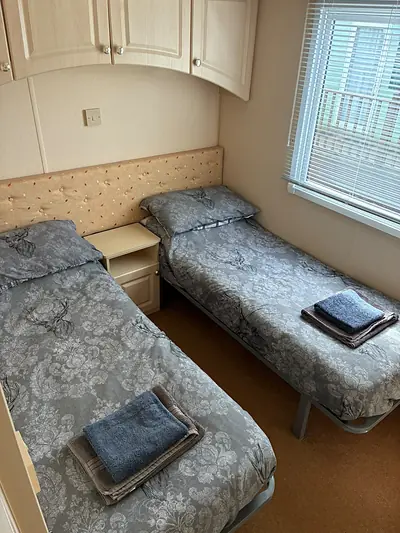 The twin bedroom in The West Lakes Caravan.
